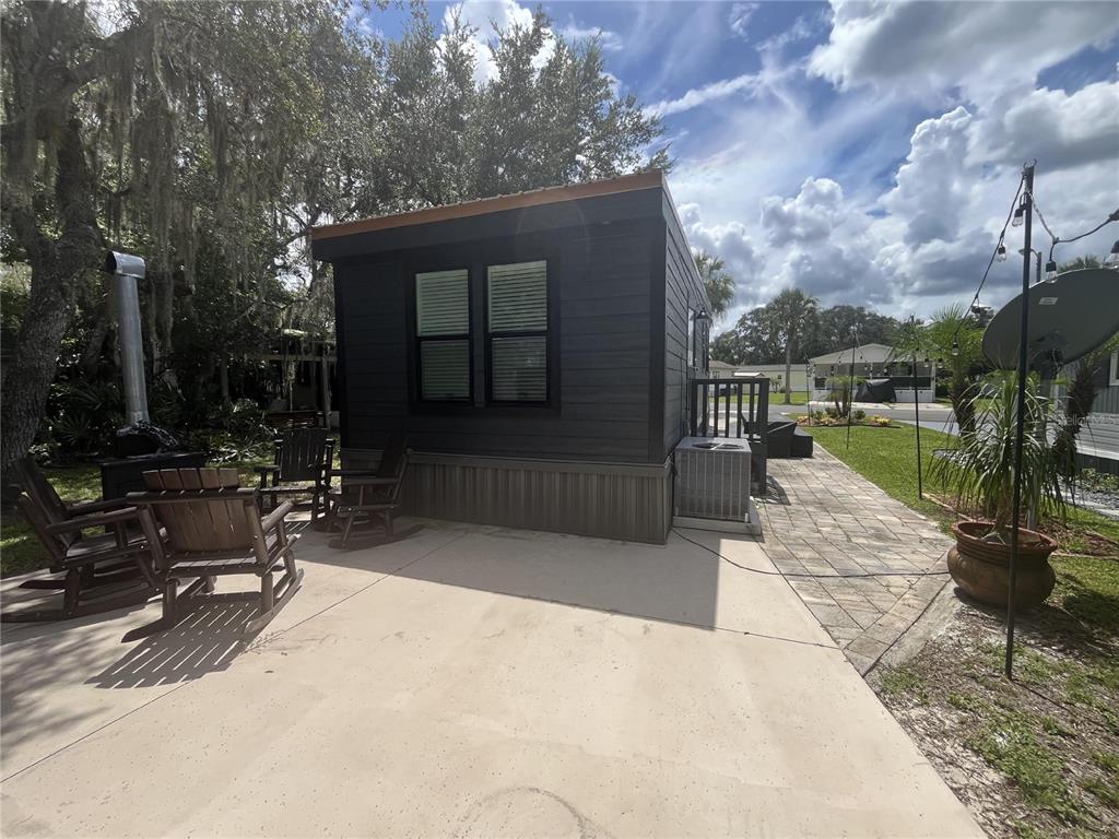112 East Appaloosa Trail River Ranch, FL 33867 - Photo 7 of 10 a view of swimming pool with outdoor seating and plants