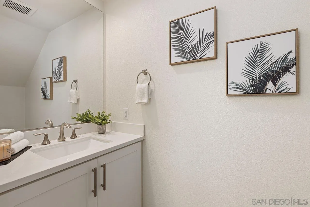 3008 Estero Road Carlsbad, CA 92010 - Photo 11 of 47 a bathroom with a sink and a mirror
