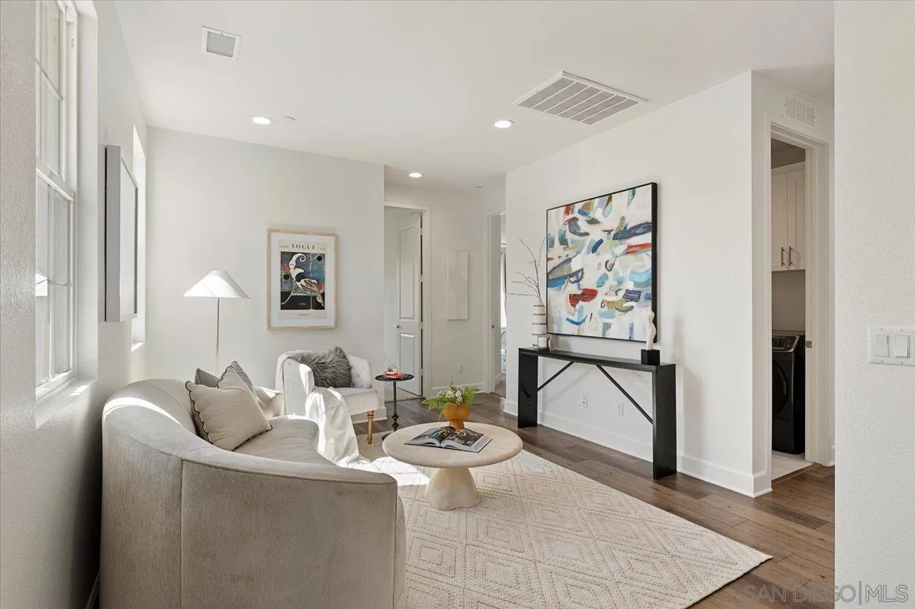3008 Estero Road Carlsbad, CA 92010 - Photo 12 of 47 a living room with furniture and a painting on the wall