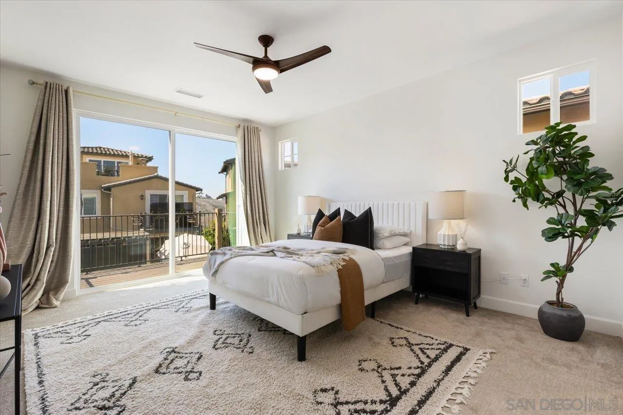 3008 Estero Road Carlsbad, CA 92010 - Photo 14 of 47 a bedroom with bed and a large window