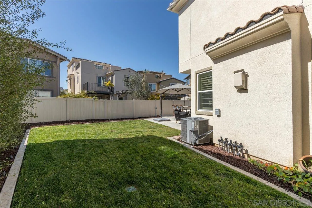 3008 Estero Road Carlsbad, CA 92010 - Photo 29 of 47 a backyard of a house with table and chairs