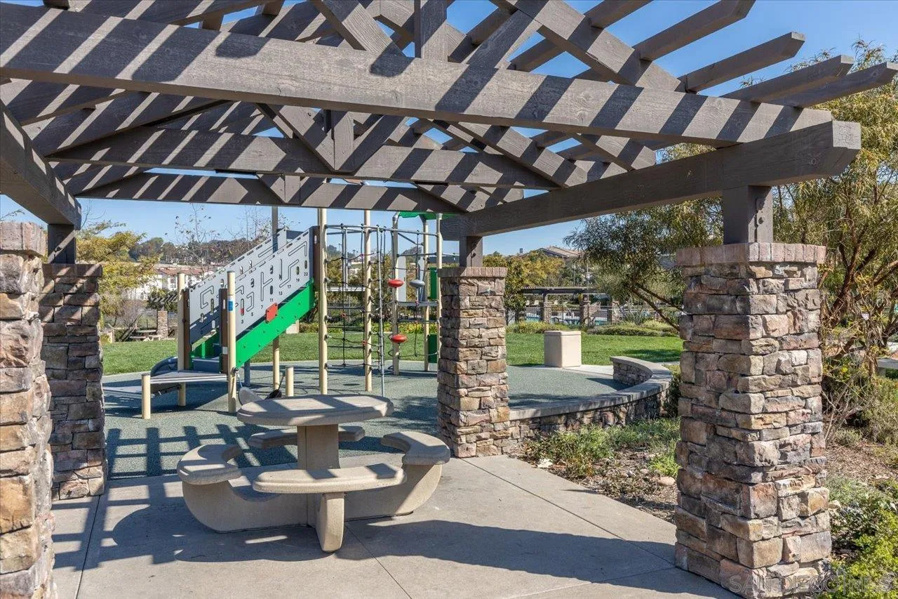 3008 Estero Road Carlsbad, CA 92010 - Photo 40 of 47 a building outdoor space with patio furniture and potted plants