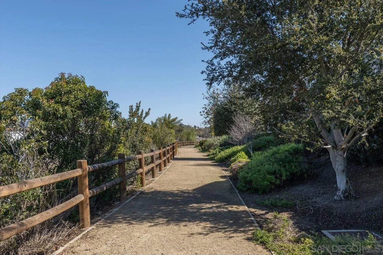 3008 Estero Road Carlsbad, CA 92010 - Photo 45 of 47 a view of a pathway with a wrought fence