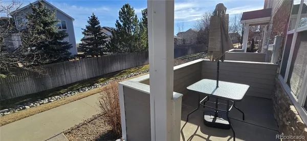 a view of balcony with furniture