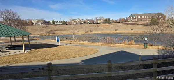 a view of a swimming pool with an outdoor seating