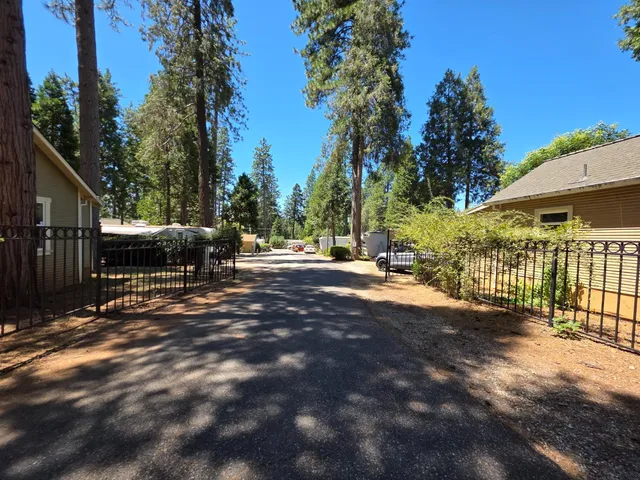 a view of street with trees in the background