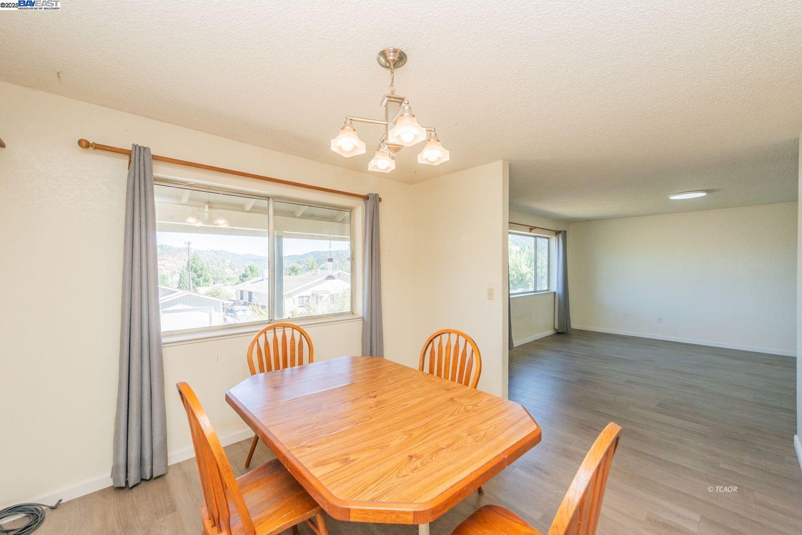 10 2nd Avenue Lewiston, CA 96052 - Photo 11 of 38 a view of a dining room with furniture window and wooden floor