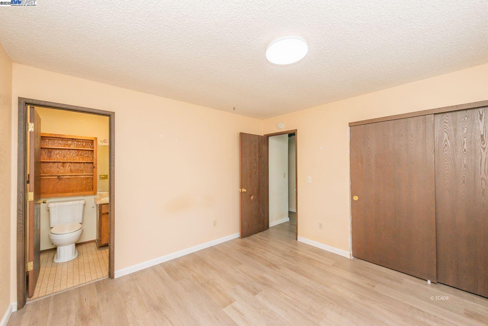 10 2nd Avenue Lewiston, CA 96052 - Photo 22 of 38 a view of empty room with wooden floor and fan