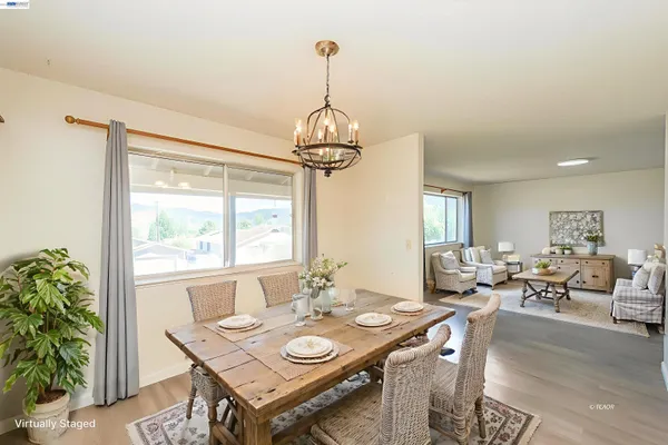 a view of a dining room with furniture window and outside view