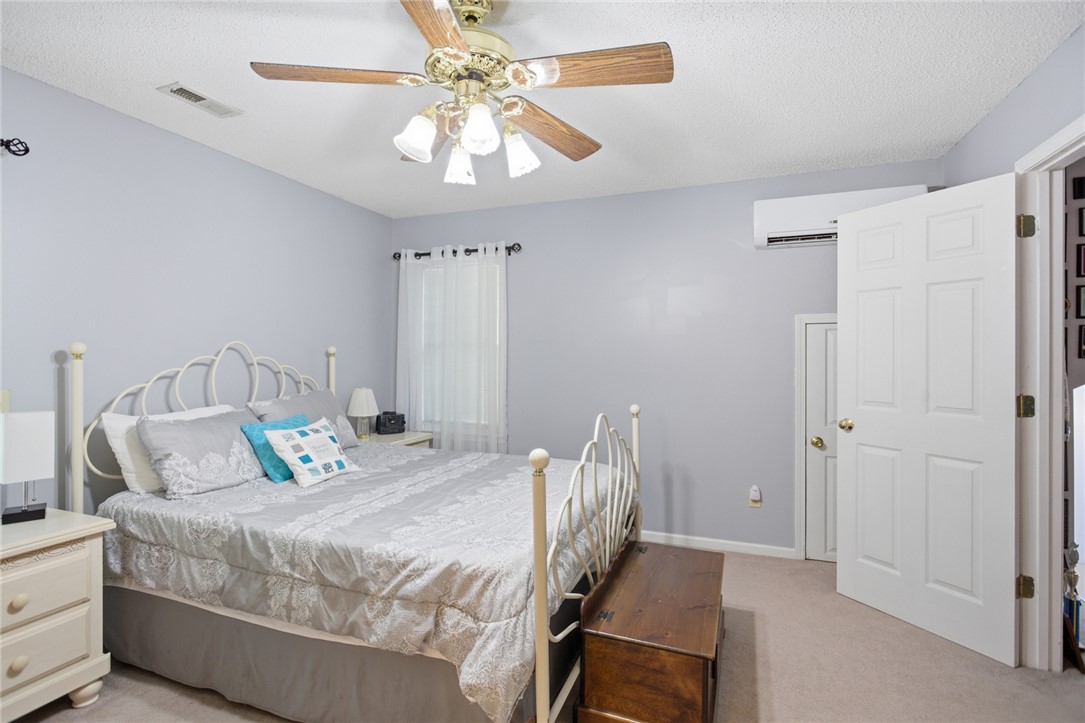 110 Snug Harbor Road Seneca, SC 29678 - Photo 16 of 37 This cozy bedroom offers comfort and a tranquil atmosphere for restful nights.