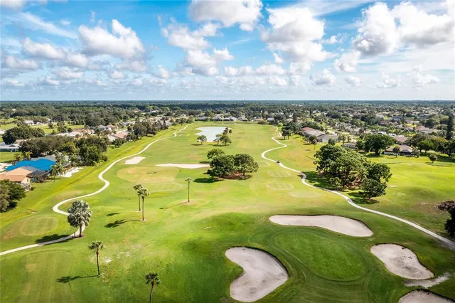 a view of a swimming pool with an outdoor seating