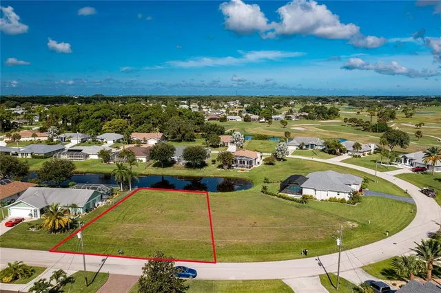 a view of a swimming pool with an outdoor seating