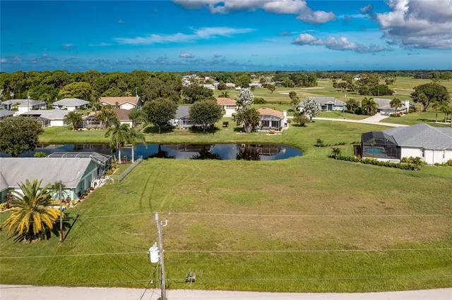a view of a swimming pool with an outdoor seating