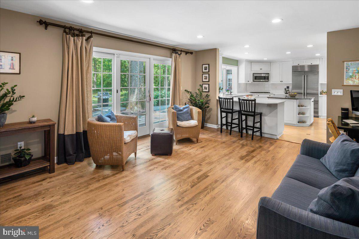 1873 Stuart Road West Princeton, NJ 08540 - Photo 13 of 46 a living room filled with furniture and a kitchen view