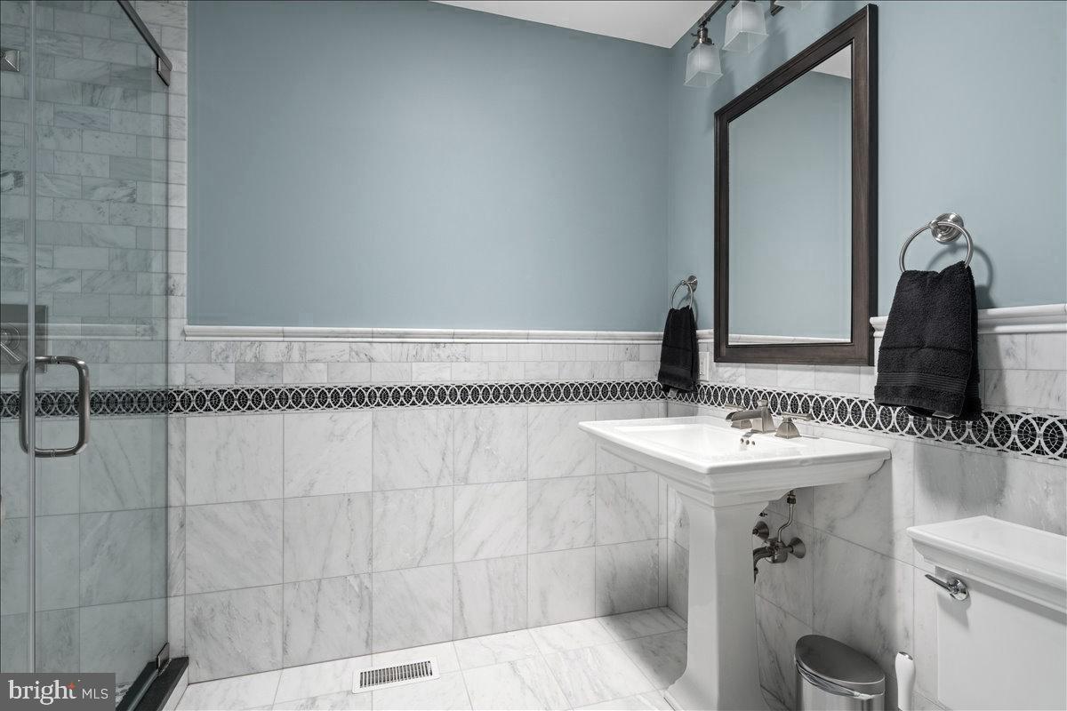 1873 Stuart Road West Princeton, NJ 08540 - Photo 24 of 46 a bathroom with a sink and a mirror