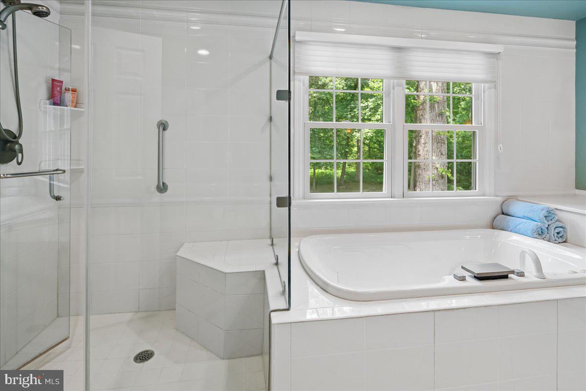 1873 Stuart Road West Princeton, NJ 08540 - Photo 29 of 46 a bathroom with a bath tub and a shower