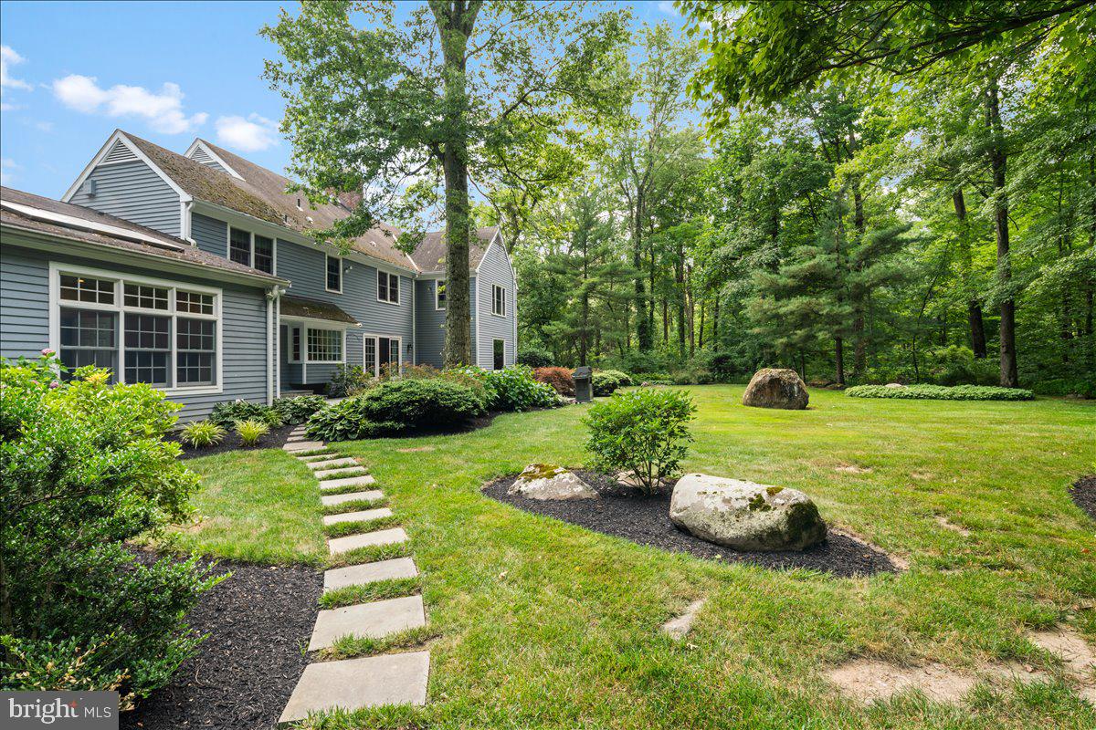 1873 Stuart Road West Princeton, NJ 08540 - Photo 45 of 46 a view of a house with a backyard and a tree