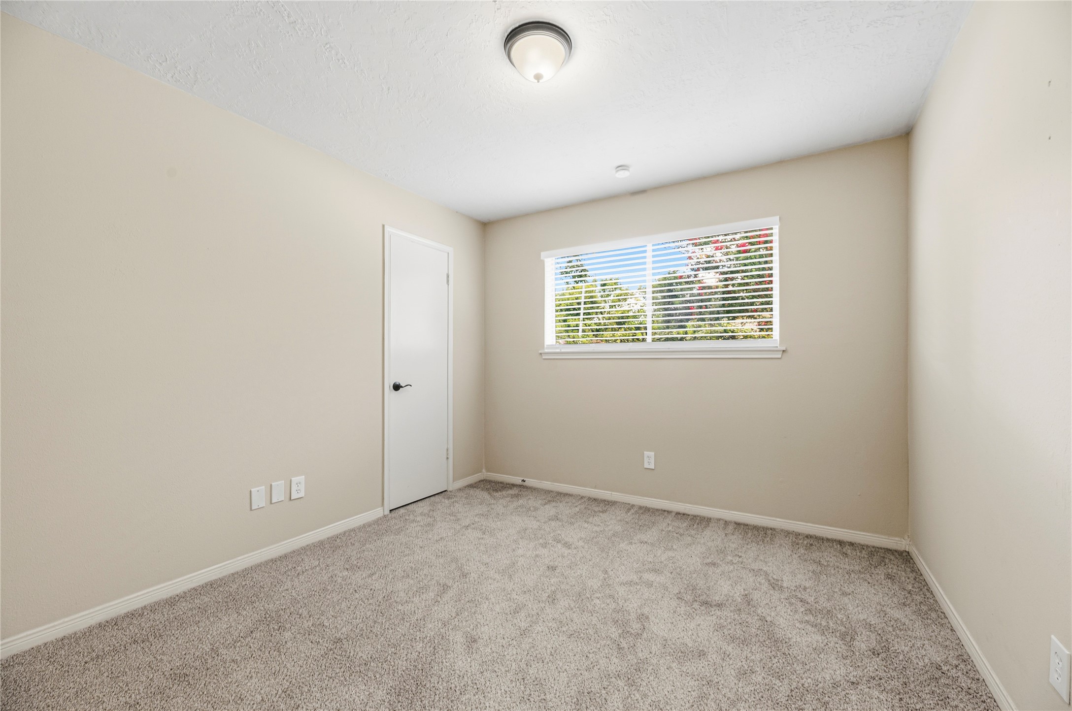 6931 Sandy Knolls Drive Spring, TX 77379 - Photo 16 of 21 The secondary bedroom with a clean, modern aesthetic
**6931 Sandy Knolls Dr., Spring, TX 77379**