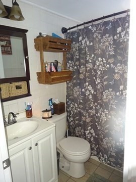 15 Cranberry Road Sagamore, MA 02561 - Photo 20 of 42 a bathroom with a sink toilet and vanity