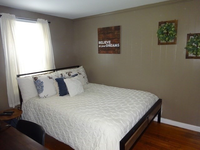 15 Cranberry Road Sagamore, MA 02561 - Photo 21 of 42 a large bed sitting in a bedroom next to a window