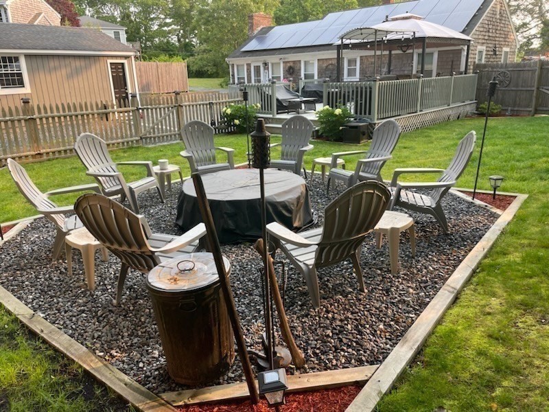 15 Cranberry Road Sagamore, MA 02561 - Photo 24 of 42 a view of a chairs and table in backyard