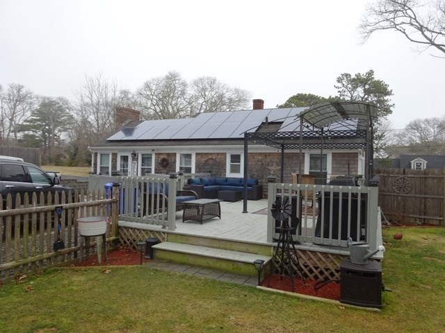 15 Cranberry Road Sagamore, MA 02561 - Photo 25 of 42 a view of a house with a backyard and deck