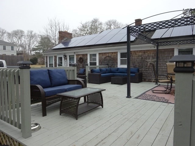 15 Cranberry Road Sagamore, MA 02561 - Photo 27 of 42 a outdoor living space with furniture and a fireplace