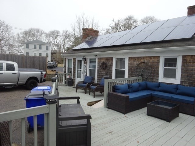 15 Cranberry Road Sagamore, MA 02561 - Photo 29 of 42 a outdoor living space with furniture and a fireplace