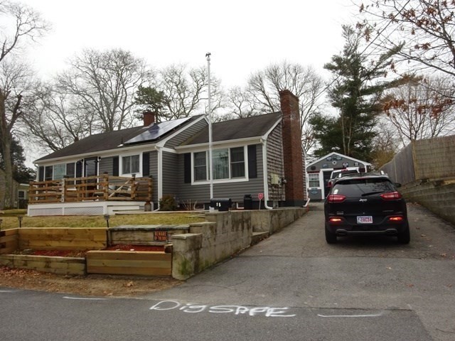 15 Cranberry Road Sagamore, MA 02561 - Photo 3 of 42 a car parked in front of a house