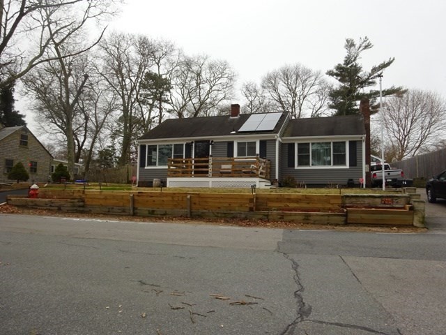 15 Cranberry Road Sagamore, MA 02561 - Photo 4 of 42 a front view of a house with a yard