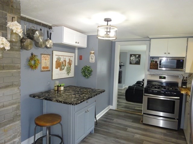 15 Cranberry Road Sagamore, MA 02561 - Photo 8 of 42 a kitchen with stainless steel appliances granite countertop a stove a sink and a refrigerator