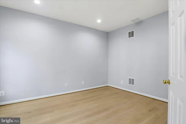 a bathroom with a sink toilet and a mirror