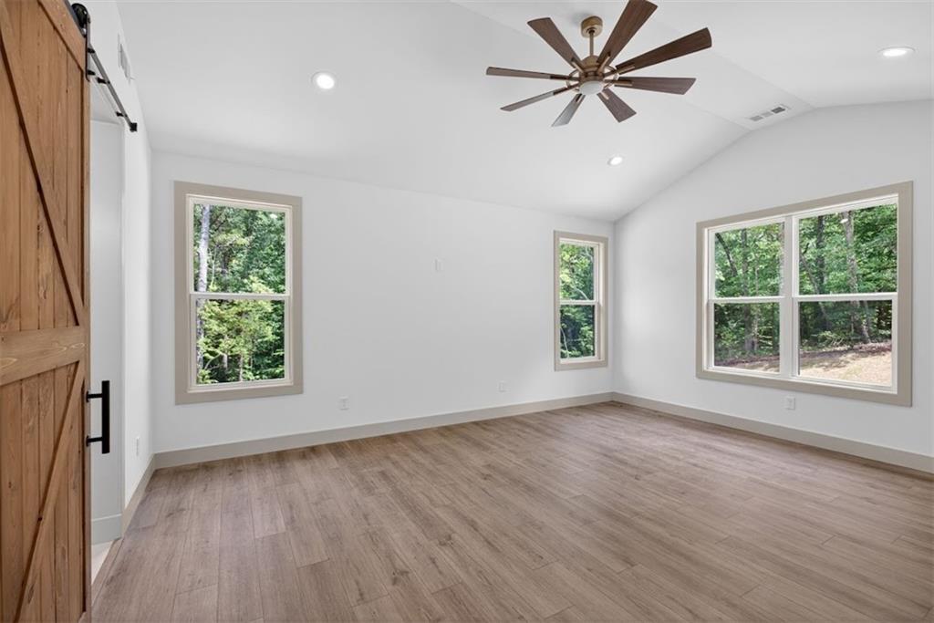 1416 Morgan Road Bremen, GA 30110 - Photo 7 of 32 wooden floor in an empty room with a window