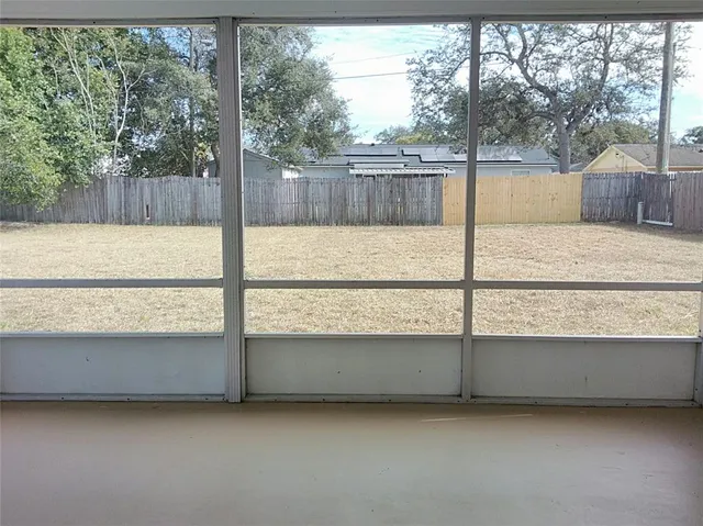 a view of backyard with green space