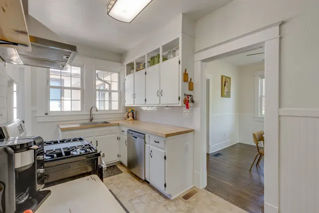 a kitchen that has a lot of cabinets in it