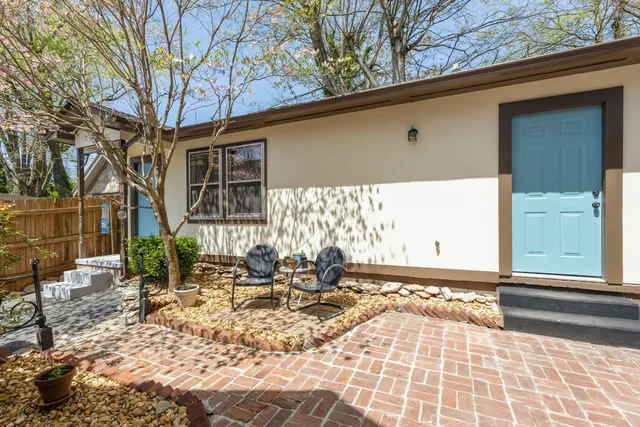 a front view of a house with sitting area