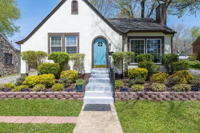 a front view of a house with garden