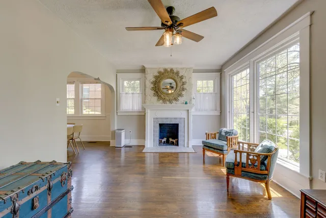 a living room with furniture and a fireplace