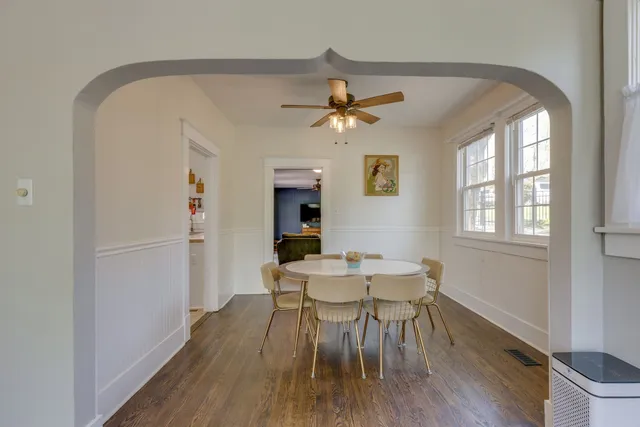 a view of a dining room with furniture window and wooden floor