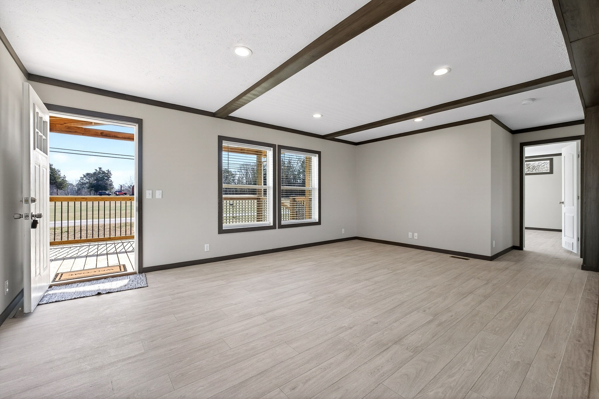 3881 Shellsford Road McMinnville, TN 37110 - Photo 12 of 44 an empty room with wooden floor and windows