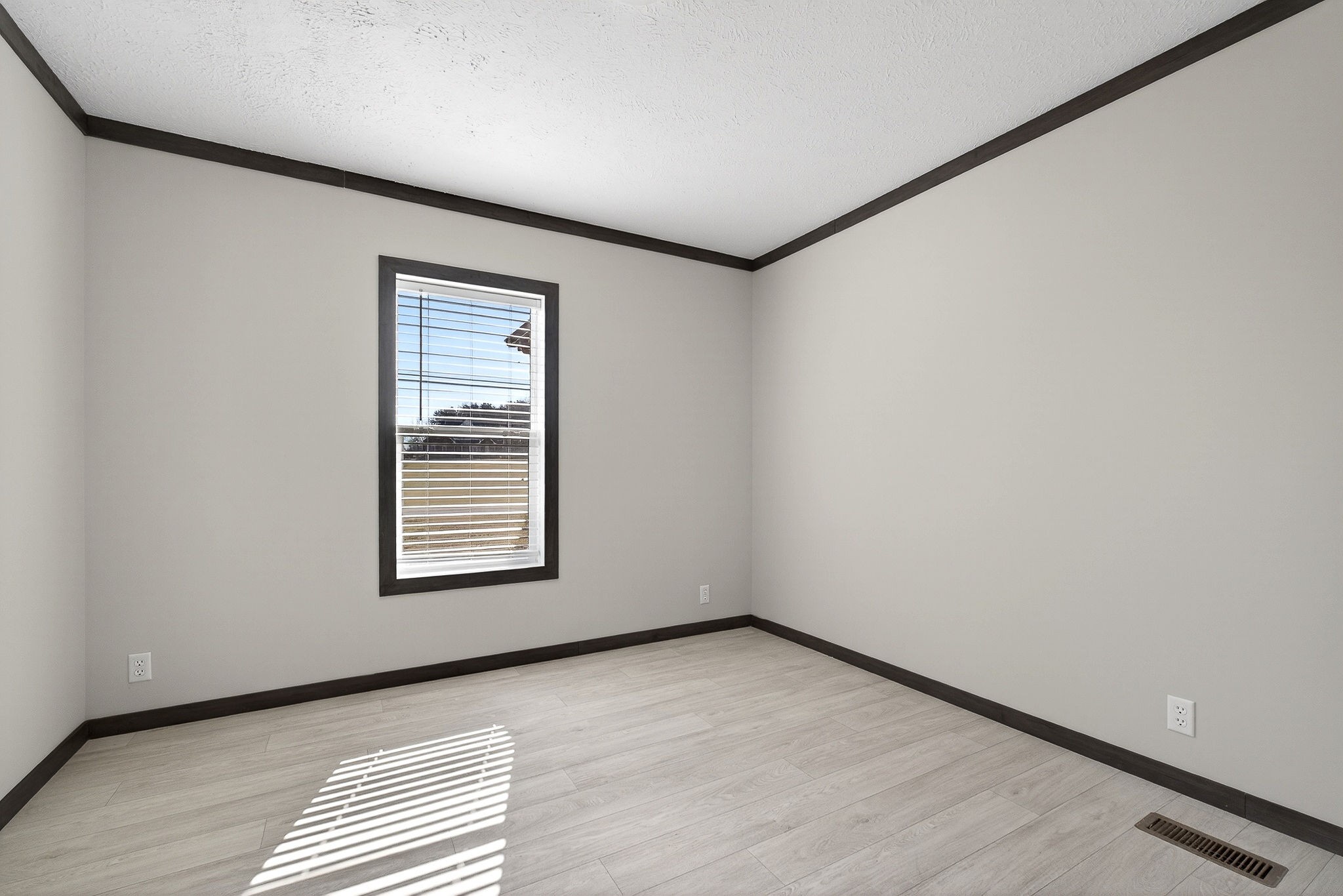 3881 Shellsford Road McMinnville, TN 37110 - Photo 19 of 44 an empty room with wooden floor and windows