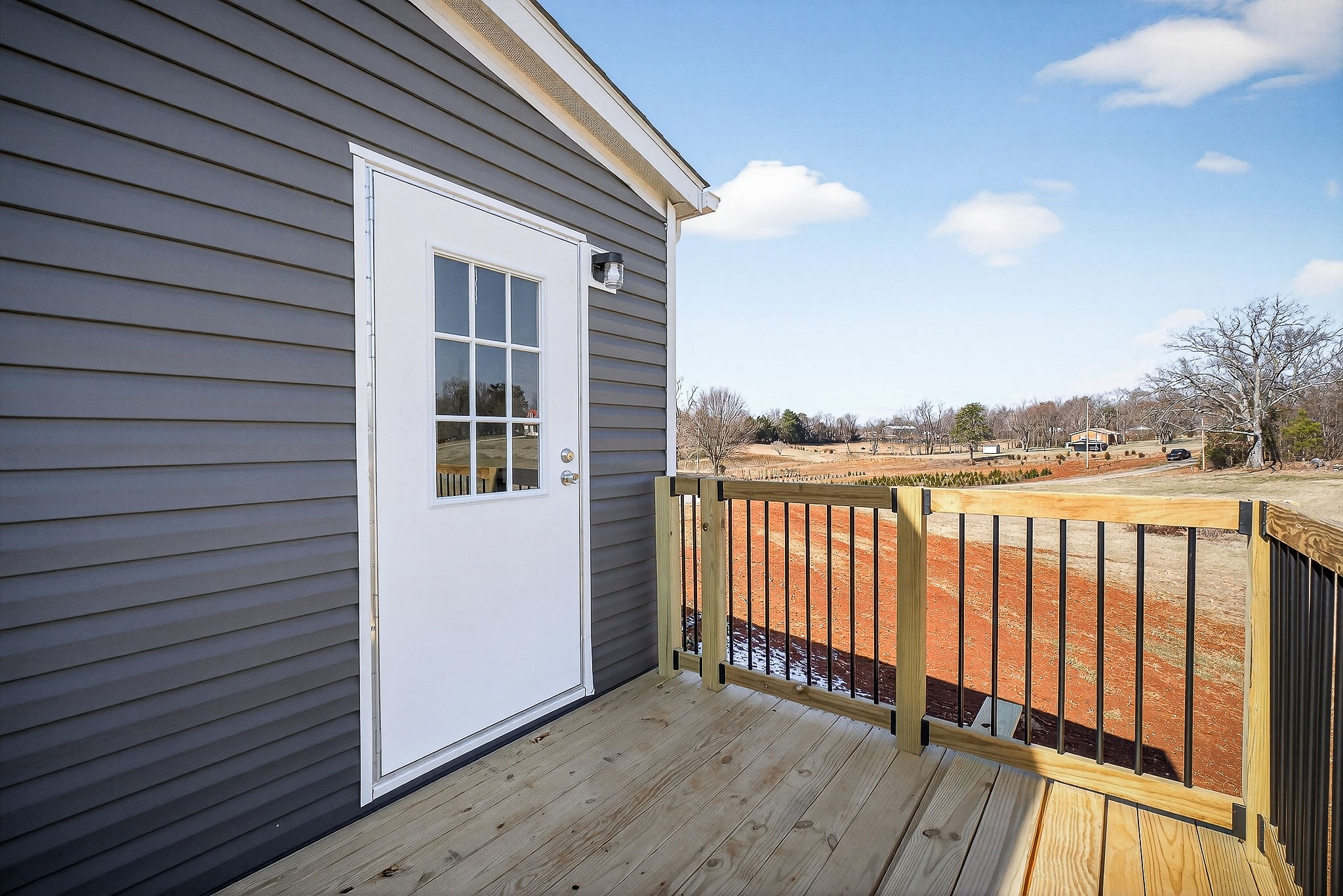 3881 Shellsford Road McMinnville, TN 37110 - Photo 21 of 44 a view of a balcony with wooden floor