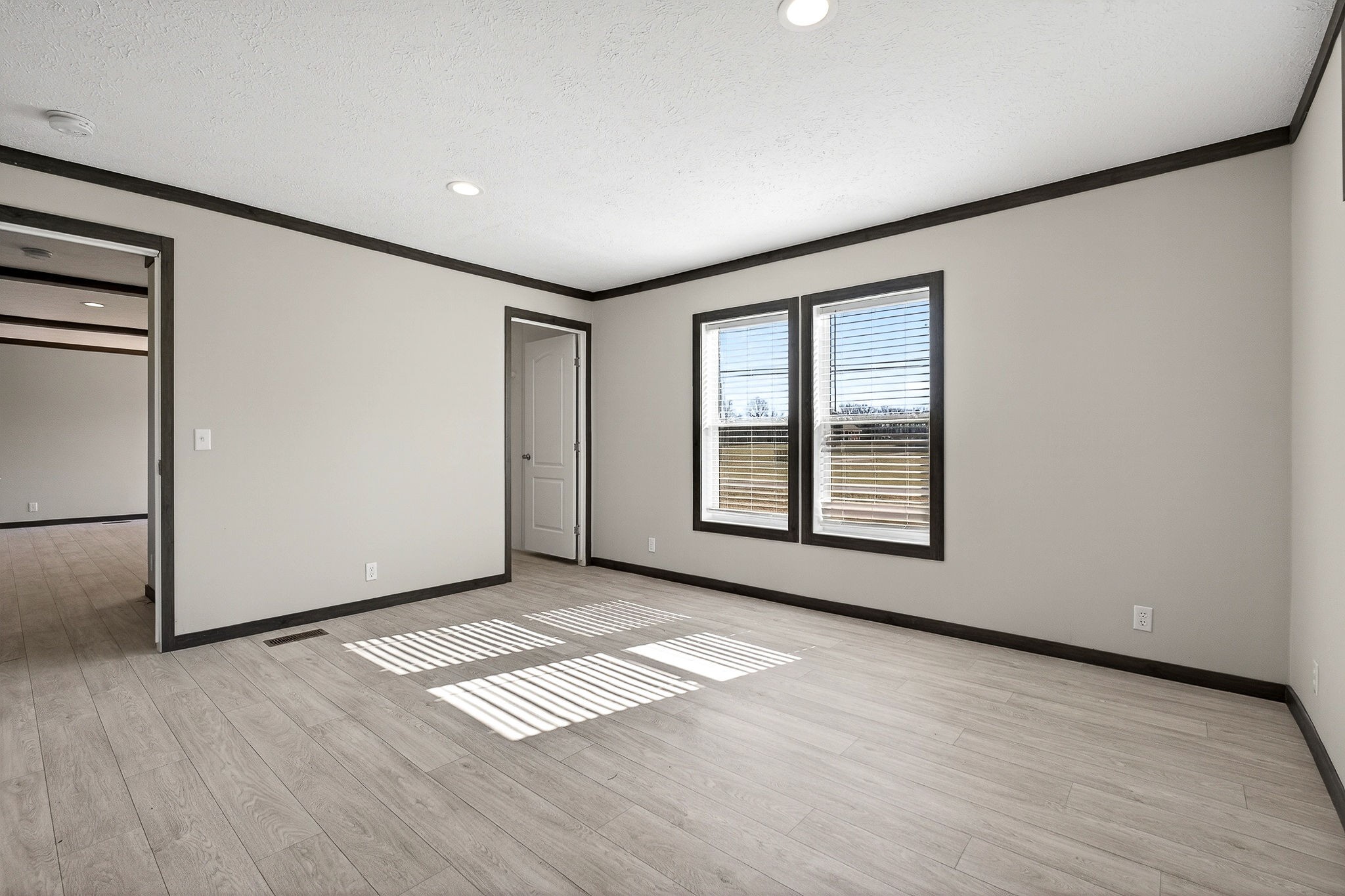 3881 Shellsford Road McMinnville, TN 37110 - Photo 24 of 44 an empty room with wooden floor and windows