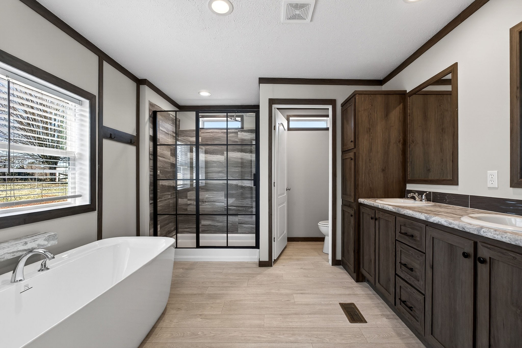 3881 Shellsford Road McMinnville, TN 37110 - Photo 26 of 44 a spacious bathroom with a tub mirror and sink