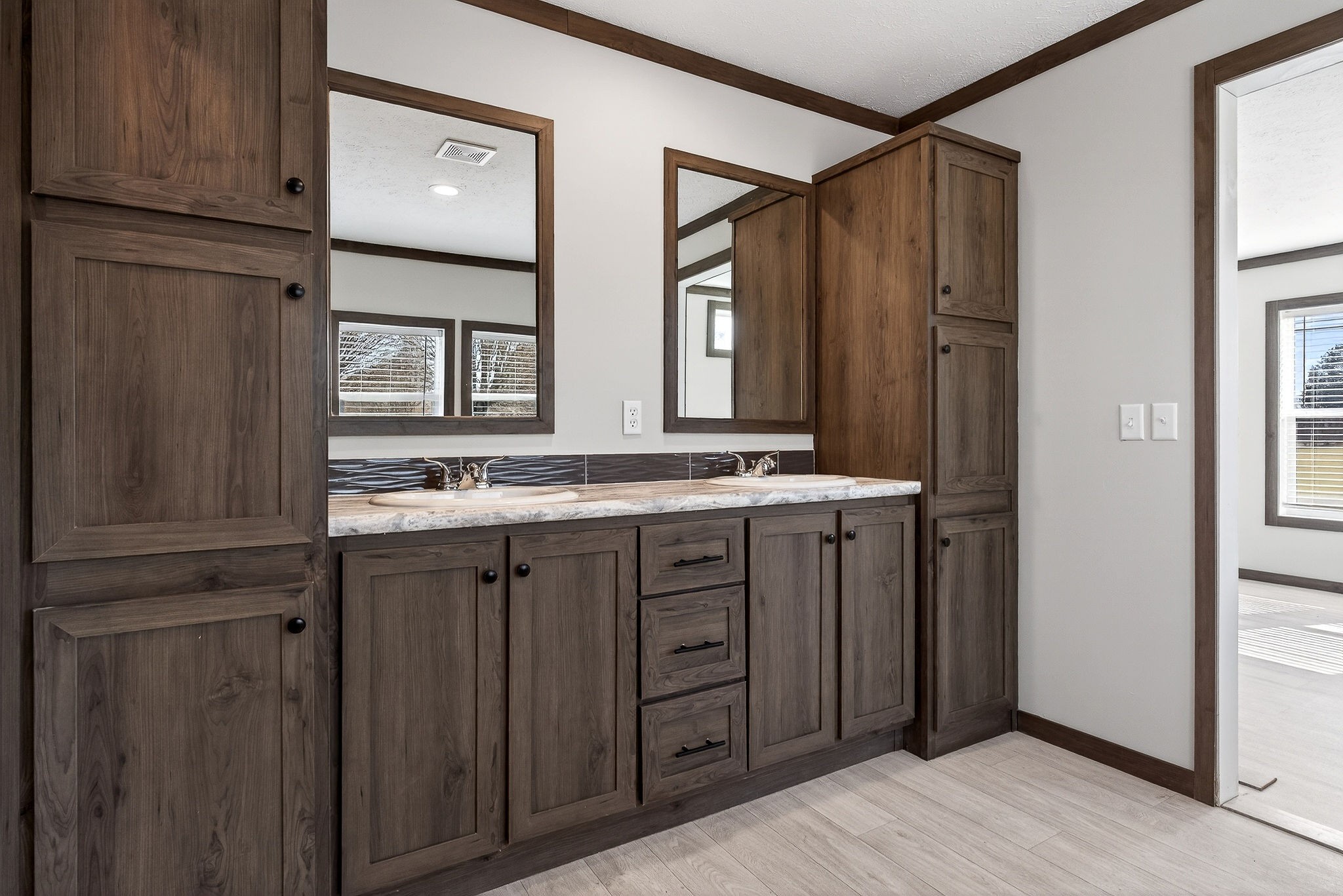 3881 Shellsford Road McMinnville, TN 37110 - Photo 28 of 44 a bathroom with double vanity and a mirror