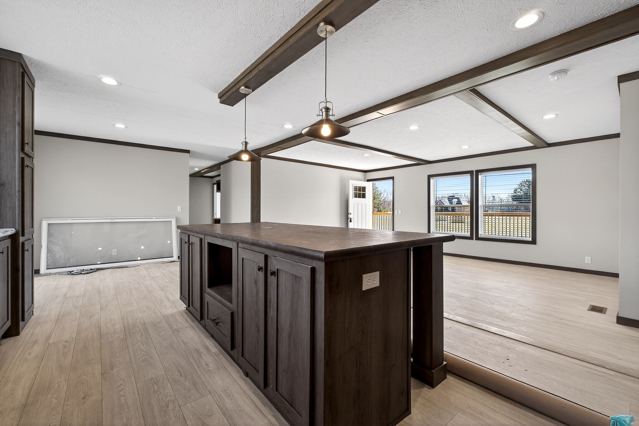 3881 Shellsford Road McMinnville, TN 37110 - Photo 30 of 44 a hallway with wooden floor windows and a kitchen view