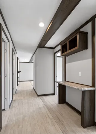 a view of a big room with wooden floor and electronic appliances