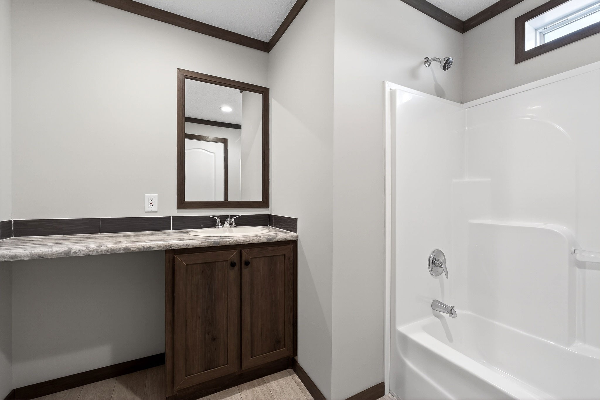 3881 Shellsford Road McMinnville, TN 37110 - Photo 38 of 44 a bathroom with a granite countertop sink mirror and a bathtub