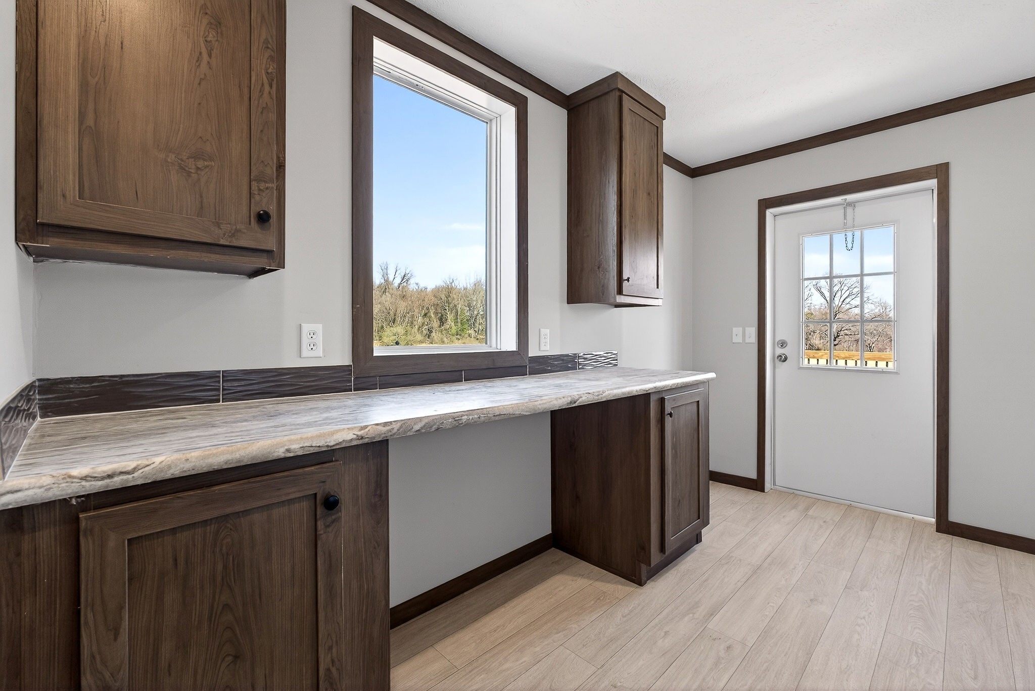 3881 Shellsford Road McMinnville, TN 37110 - Photo 40 of 44 a kitchen with granite countertop a sink cabinets and wooden floor