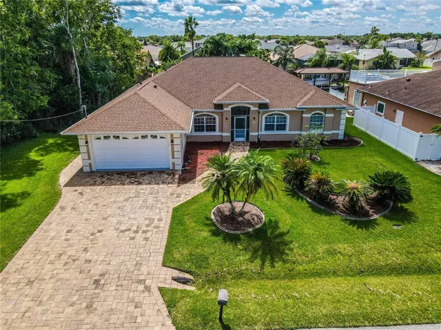 a aerial view of a house with garden